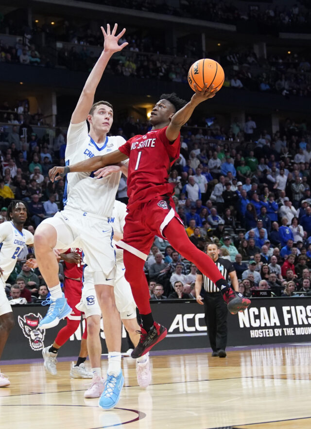 North Carolina State guard Jarkel Joiner, right, drives against Creighton center Ryan Kalkbrenner during the second half of a first-round college basketball game in the men's NCAA Tournament on Friday, March 17, 2023, in Denver. (AP Photo/John Leyba)