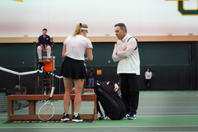 Sophomore Alina Shcherbinina, left, discusses her match with head coach Joey Scrivano, right, during Baylor women's tennis' non-conference match against No. 41 University of Denver Tuesday in the Hawkins Indoor Tennis Center.
Olivia Havre | Photographer