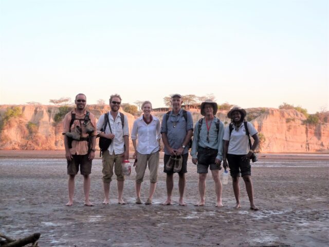 Co-authors David Fox (University of Minnesota), Bill Lukens (James Madison University), Kirsten Jenkins (Tacoma Community College), John Kingston (University of Michigan), Al Deino (Berkeley Geochronology Center), and Rahab Kinyanjui (National Museums of Kenya and Max Planck Institute) preparing to cross the Turkwel River in northern Kenya on their way to the west Turkana sites. This interdisciplinary team focused on many aspects of the geology and paleontology of the fossil sites allowing us to interpret paleoenvironments associated with ancient apes in eastern Africa. Photo courtesy of Bill Lukens