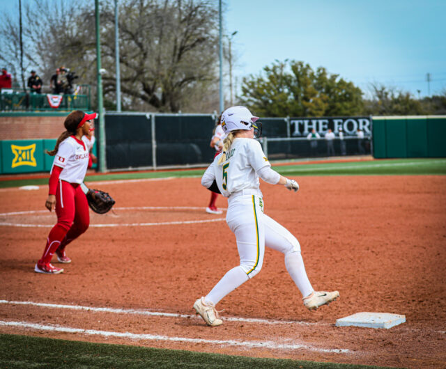 Junior catcher Sydney Collazos (15) rounds first base as she gets called out during a game against No. 1 University of Oklahoma as part of the Getterman Classic on Feb. 19 at Getterman Stadium.
Kenneth Prabhakar | Photo Editor