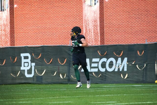 Redshirt freshman outside linebacker Kyler Jordan (51) runs from the sideline during Baylor football's ninth day of spring practice on Tuesday at the team's outdoor practice field.
Olivia Havre | Photographer