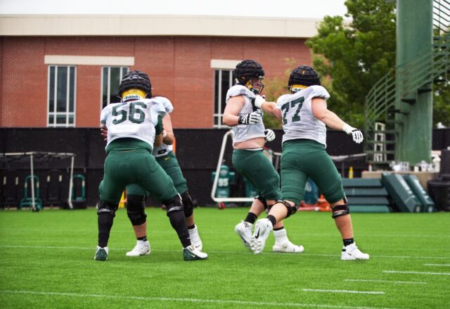Fifth-year senior offensive lineman Clark Barrington (56, left) and redshirt sophomore offensive lineman Tate Williams (77, right) charge forward and try to hold blocks during Baylor football's seventh practice of the spring on Thursday at the team's outdoor practice field.
Olivia Havre | Photographer
