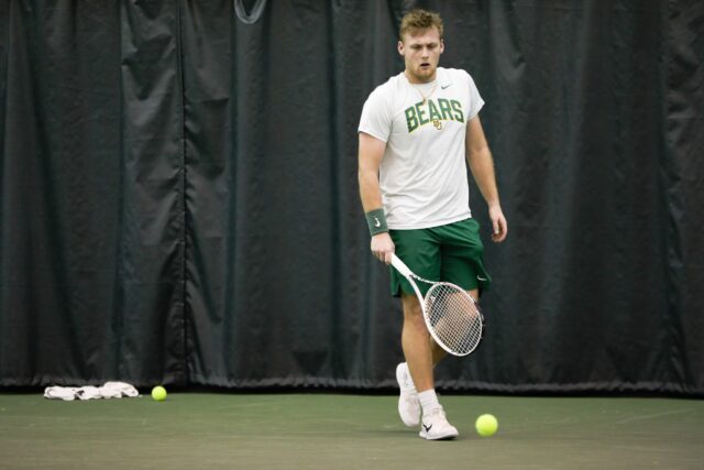 Senior Finn Bass gets ready to serve during Baylor men's tennis' non-conference match against No. 4 University of Michigan, on Feb. 3, in the Hawkins Indoor Tennis Center.
Assoah Ndomo | Photographer