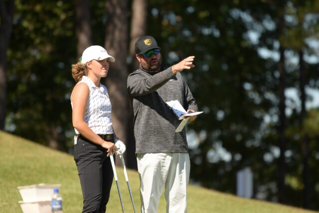Head coach Jay Goble (right) and sophomore Rosie Belsham (left) discuss something during Baylor women's golf's first day of the Stephens Cup on Oct. 18, 2021 at the Alotian Club in Roland, Ark.
Photo courtesy of Baylor Athletics