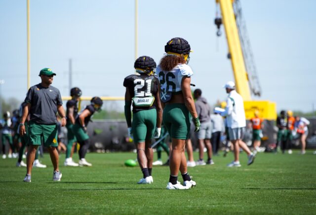 Redshirt sophomore wide receiver Jonah Burton (26) watches part of the team's scrimmage during Baylor football's first official scrimmage of the spring, on Saturday, at the team's practice field.
Olivia Havre | Photographer