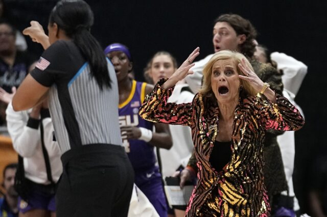 LSU head coach Kim Mulkey reacts to a call during the first half of the NCAA Women's Final Four championship basketball game against Iowa Sunday in Dallas. (AP Photo/Tony Gutierrez)