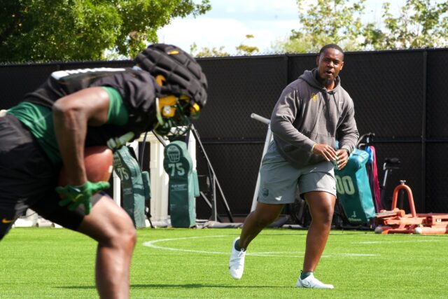 Outside linebackers coach Caleb Collins orchestrates a drill to his position group during Baylor football's ninth day of spring practice on Tuesday at the team's outdoor practice field.
Olivia Havre | Photographer