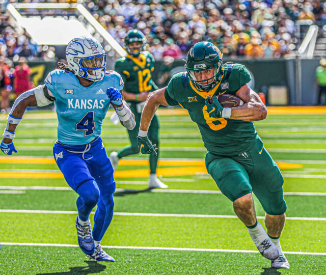 Fifth-year senior tight end Ben Sims (8) tries to outrun a Jayhawk defender during a conference game against the University of Kansas on Oct. 22, 2022 at McLane Stadium.
Kenneth Prabhakar | Photographer