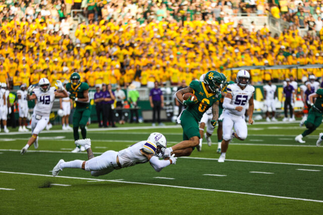 Sixth-year senior wide receiver Gavin Holmes (6) evades a tackle at his feet as part of his 72-yard punt return touchdown during Baylor football's season opener against the University of Albany on Sept. 3, 2022 at McLane Stadium.
Ken Prabhakar | Photographer