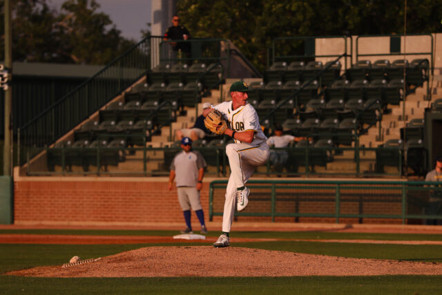 Junior right-handed pitcher Jared Matheson (27) winds up and gets ready to deliver his pitch during Baylor baseball's midweek bout with Texas A&M University–Corpus Christi on Wednesday at Baylor Ballpark.
Assoah Ndomo | Photographer