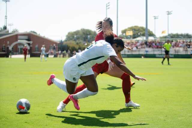 Freshman midfielder Salma Simonin stumbles to the ground during Baylor soccer's conference match against No. 25 Texas Tech on Sunday at Betty Lou Mays Field. Assoah Ndomo | Photographer