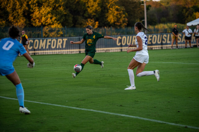 Graduate student forward Jenna Patterson (4) controls the ball with her left foot as she attacks the Wildcats' goal during Baylor soccer's non-conference match against Abilene Christian Sunday night at Betty Lou Mays Field. Lilly Yablon | Photographer