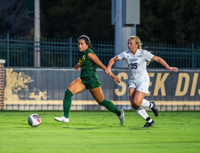 Sophomore midfielder Skye Leach (5) fights through contact from the Wildcats defender down the right side of the pitch during Baylor soccer's non-conference match against Abilene Christian on Sunday at Betty Lou Mays Field. Lilly Yablon | Photographer