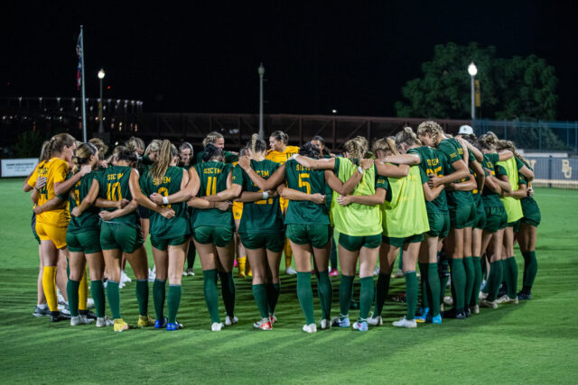 The Baylor soccer team huddles up after its 7-0 thumping of Abilene Christian on Sunday at Betty Lou Mays Field. Lilly Yablon | Photographer