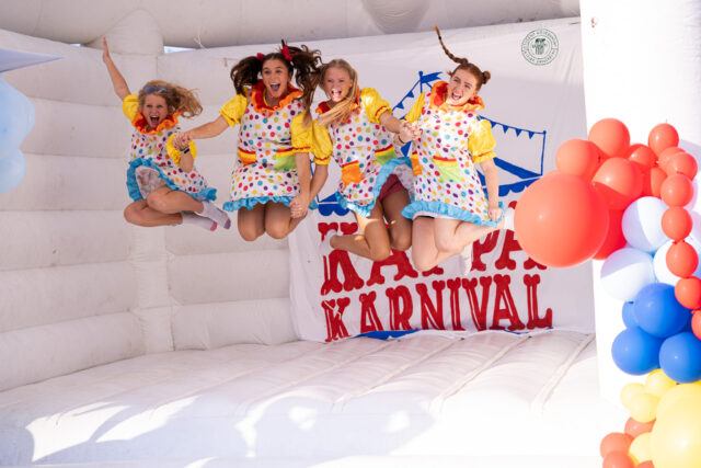 Girls from Kappa Kappa Gamma jumping in a bounce house during the Kappa Karnival. Lilly Yablon | Photographer