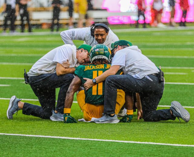 Junior wide receiver Ketron Jackson Jr. left in the first half of Saturday's game with an apparent head injury. Kenneth Prabhakar | Photo Editor