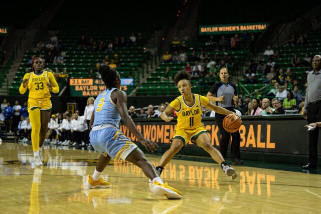 Junior guard Jada Walker (11) breaks down her defender and looks to attack from the wing during No. 19 Baylor women's basketball's nonconference game against Southern on Monday in the Ferrell Center. Kassidy Tsikitas | Photographer