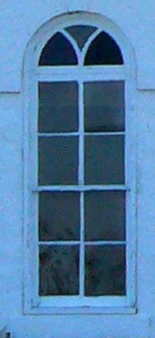 A figure can be spotted in the bottom left corner of the window pain of Old Rock Church in Cranfills Gap.