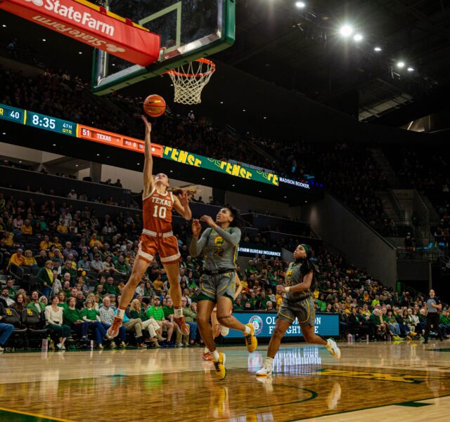 Longhorns senior guard Shay Holle (10) rises up for a right-handed layup on a fast break during No. 13 Baylor women's basketball's game against No. 12 Texas on Thursday in the Foster Pavilion. Kassidy Tsikitas | Photo Editor