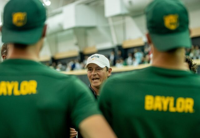 Head coach Michael Woodson speaks to his team before No. 14 Baylor men's tennis' nonconference match against No. 1 Ohio State on Wednesday in the Hawkins Indoor Tennis Center. Lilly Yablon | Photographer