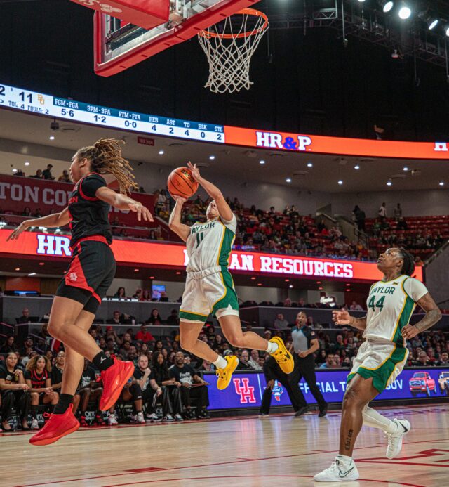 Junior guard Jada Walker (11) scored eight of her 10 points in the first quarter of then-No. 13 Baylor women's basketball's conference game against Houston on Sunday in the Fertitta Center in Houston. Michael Haag | Sports Editor