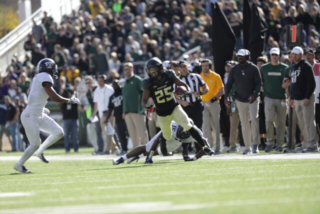 Former Baylor running back Trestan Ebner surges through the TCU's defense in the last home game when the Bears donned black uniforms on Nov. 17, 2018, at McLane Stadium. Lariat File Photo