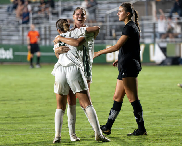 Junior defender Hannah Augustyn hugs graduate student midfielder Kai Hayes after she scored her first career goal during Baylor soccer's 2-2 draw against Texas State on Sunday night at Betty Lou Mays Field. Kassidy Tsikitas | Photographer