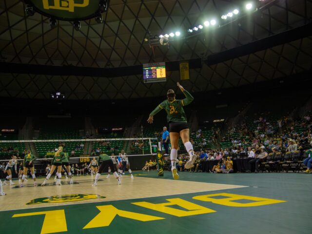 Senior outside hitter Elise McGhee makes a serve during Baylor volleyball's 3-1 win against Hawaii Saturday night at the Ferrell Center. Michael Aguilar | Photo Editor