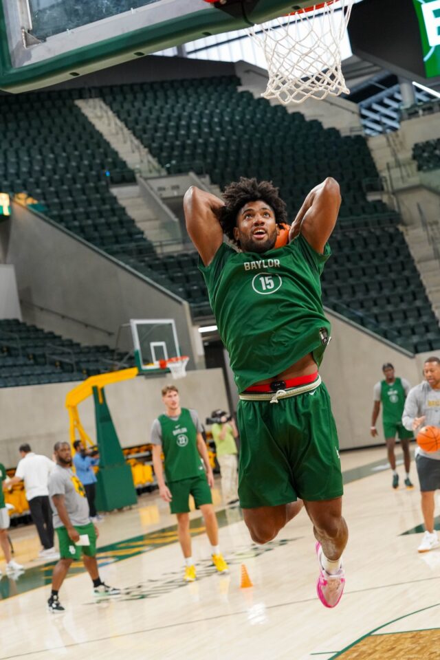 Fifth-year senior forward Norchad Omier rises to the rim for a dunk during Baylor men's basketball's first fall practice on Monday at Foster Pavilion. Foster Nicholas | Sports Editor