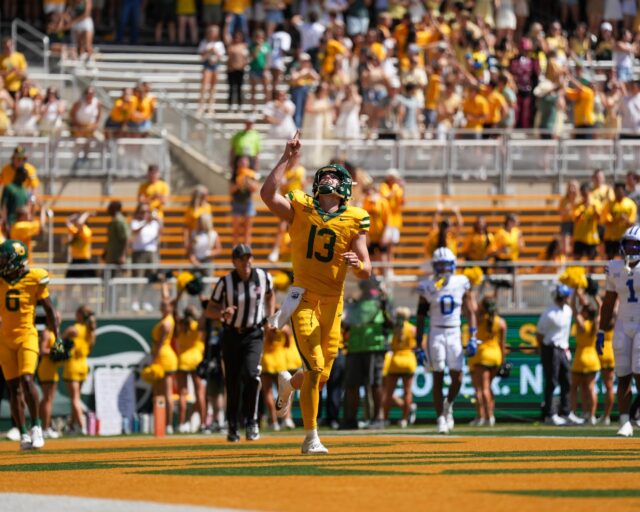 Sawyer Robertson (13) celebrates after a close-call touchdown during the Baylor VS BYU game. Mary Thurmond | Photographer