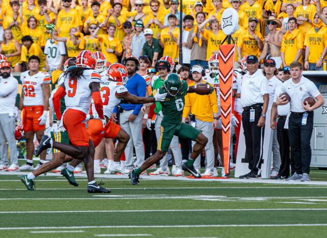 Fifth-year senior wide receiver Ashtyn Hawkins runs for a first down during Baylor football's 38-28 win over Oklahoma State on Saturday at McLane Stadium. Cameron McCollum | Photo Editor