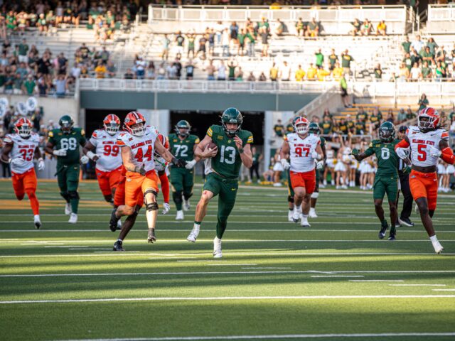 Redshirt junior quarterback Sawyer Robertson rushes toward the end zone during Baylor football's 38-28 win over Oklahoma State on Saturday at McLane Stadium. Cameron McCollum | Photo Editor