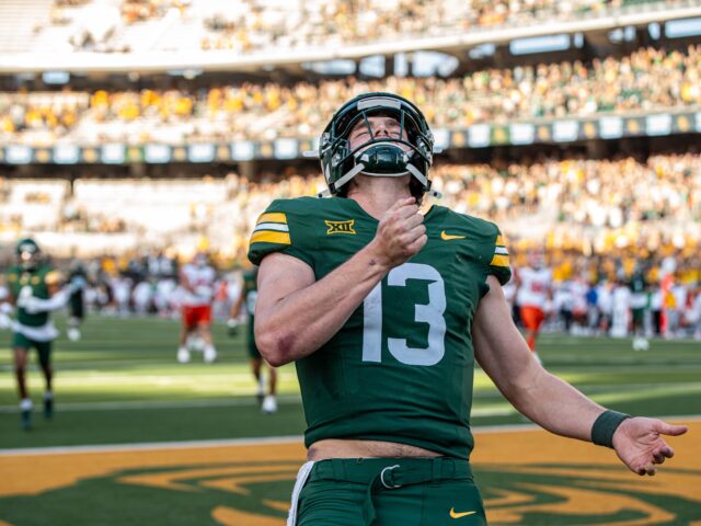 Redshirt junior quarterback Sawyer Robertson celebrates his rushing touchdown during Baylor football's 38-28 win over Oklahoma State on Saturday at McLane Stadium. Cameron McCollum | Photo Editor