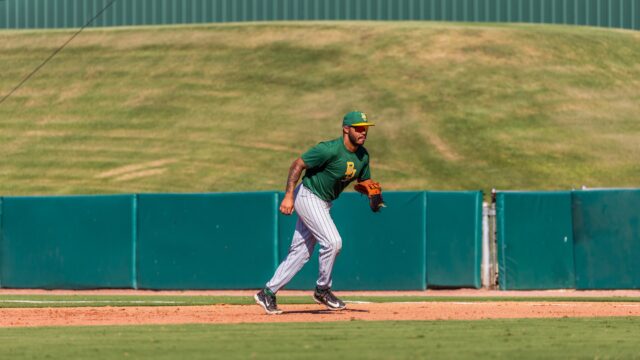 Graduate first baseman and outfielder Hunter Simmons ranges over to chase down a ground ball during an intrasquad scrimmage at Baylor Ballpark. Photo Courtesy of Baylor Athletics