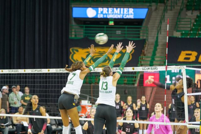 Setter Jackie Frazier and Middle Back Victoria Davis jump to block the ball in the Iowa State vs Baylor Volleyball Game. Caleb Garcia | Photographer