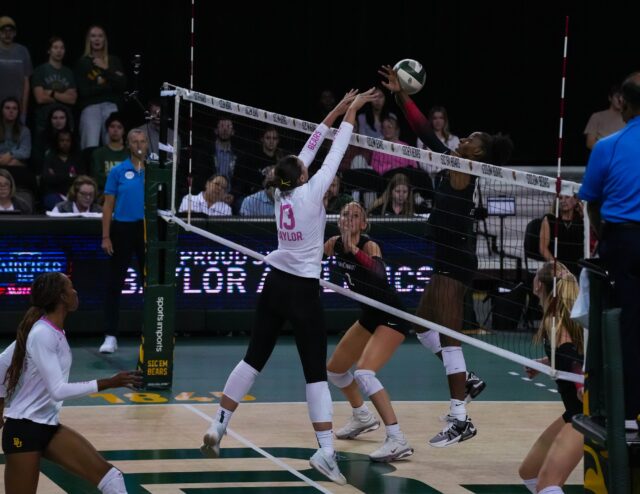 Graduate student setter Jackie Barrett Frazier leaps for a block during No. 22 Baylor volleyball's 3-0 win over Cincinnati on Thursday night at the Ferrell Center. Mary Thurmond | Photographer