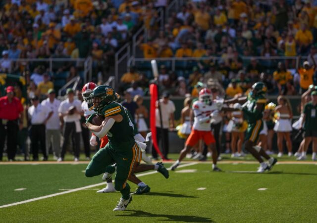 Sophomore running back Dawson Pendergrass avoids the defense and runs towards the end zone during Baylor football's 38-28 win over Oklahoma State on Saturday at McLane Stadium.