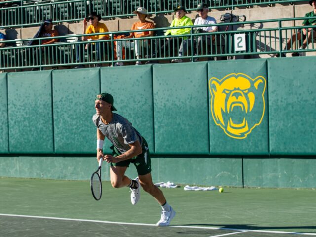 Senior Oskar Brostrom Poulsen chases after the ball during the Sweet 16 of the NCAA doubles championship at the Hurd Tennis Center on Thursday afternoon. Cameron McCollum | Photo Editor