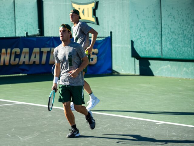 Seniors Marko Miladinovic and Oskar Brostrom Poulsen ready for the serve during the Sweet 16 of the NCAA doubles championship at the Hurd Tennis Center on Thursday afternoon. Cameron McCollum | Photo Editor