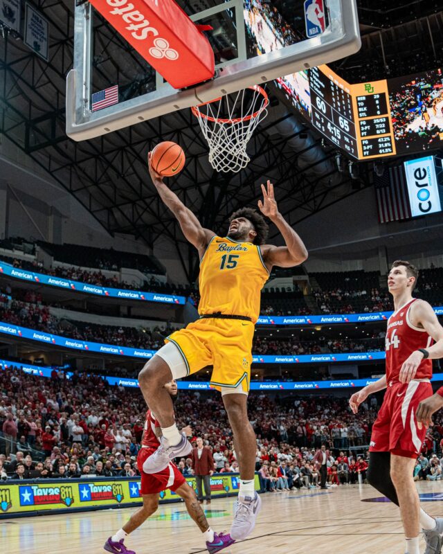 Fifth-year forward Norchad Omier puts up a layup during No. 8 Baylor men's basketball's 72-67 win on Saturday night at the American Airlines Center. Kassidy Tsikitas | Photo Editor