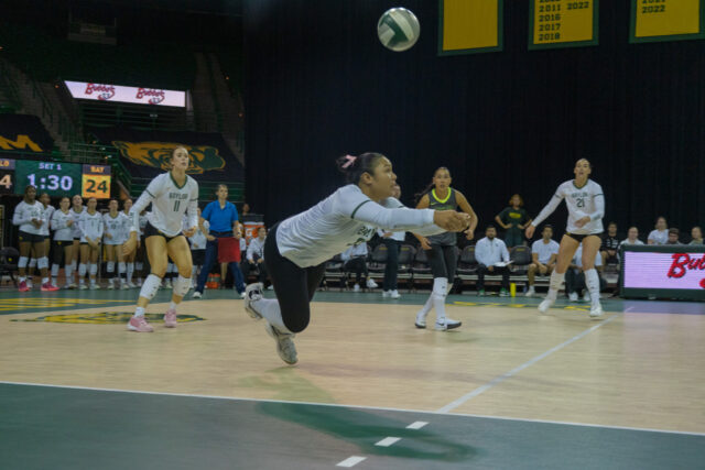 Sophomore defensive specialist, Tehani Ulufatu successful dives and returns the ball in the 3-0 game against Colorado at the Ferrell Center. Chloe McCauley | Photographer