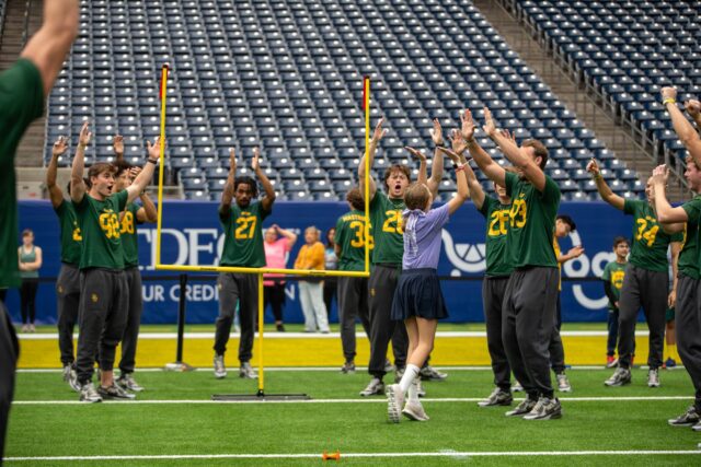 Baylor football players cheer on children from DePelchin Children's Center during the Kinder's Texas Bowl DePechlin Field Day on Monday at NRG Stadium in Houston. Mary Thurmond | Photo Editor