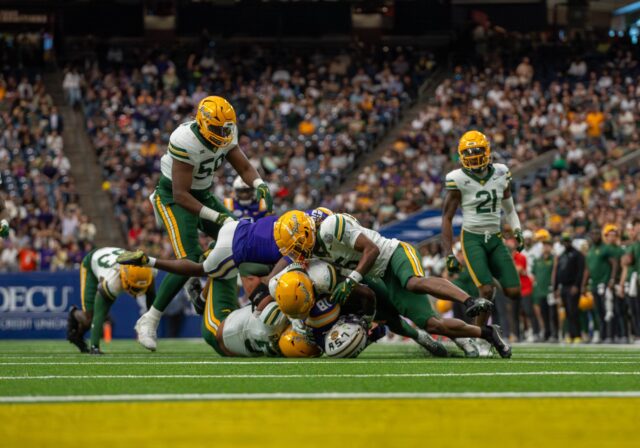 Baylor's defense swarms LSU running back Josh Williams during the Bears' 44-31 loss to LSU at the Kinder's Texas Bowl on Tuesday at NRG Stadium in Houston. Mary Thurmond | Photo Editor