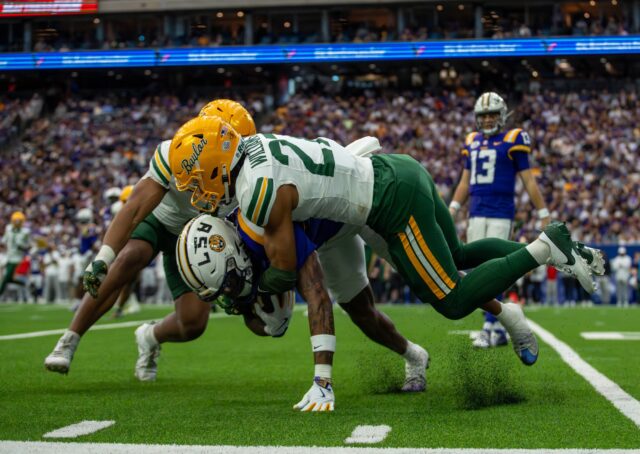 Redshirt junior cornerback Tevin Williams III tackles an LSU player during Baylor football's 44-31 Kinder's Texas Bowl loss to LSU Tuesday at NRG Stadium in Houston. Mary Thurmond | Photo Editor