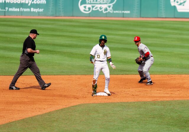 Senior Shortstop Tyriq Kemp celebrates after hitting a double and sliding into 2nd base during Baylor baseball's 16-4 victory over Youngstown State at Baylor Ballpark. Brady Harris | Photographer