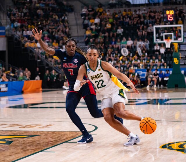 Junior guard Bella Fontleroy passes the defense during