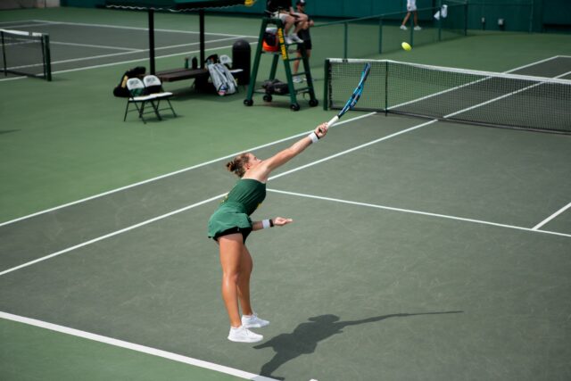 Sophomore Zuzanna Kubacha serves in her singles match against OSU on Sunday afternoon. Camie Jobe | Photographer