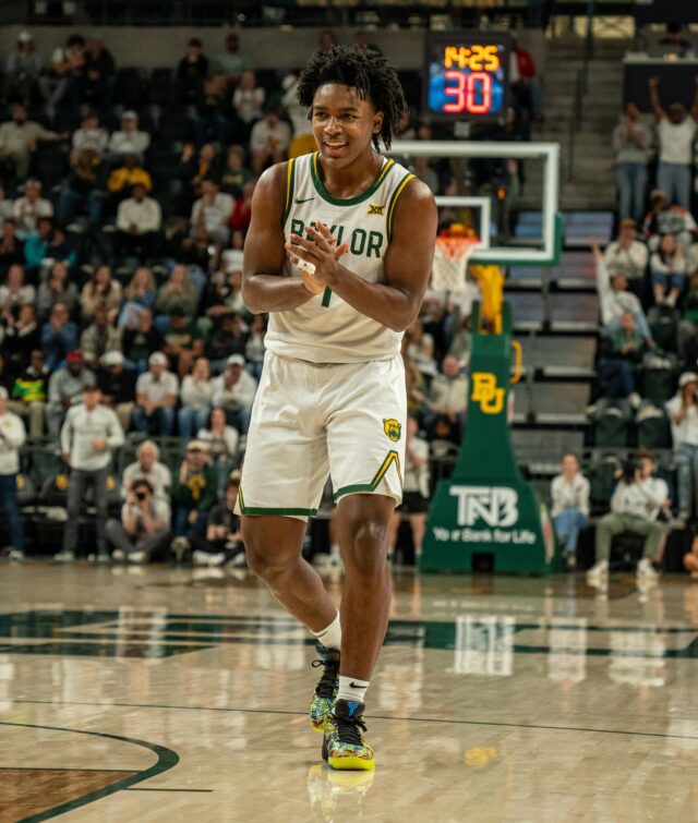 Freshman gaurd Robert O. Wright III celebrates his only shot in the 65-61 loss against No. 3 Houston Saturday night at the Foster Pavillion. Kassidy Tsikitas | Photo Editor