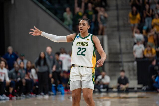 Junior guard Bella Fontleroy celebrates a 3-pointer made by a teammate during the No. 4 seeded Bears' loss against No.5 seed Ole Miss Sunday afternoon at the Foster Pavillion. Kassidy Tsikitas | Photo Editor