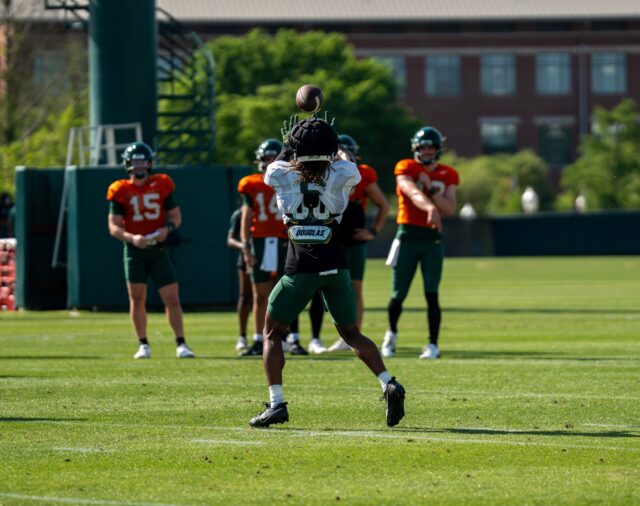 Sixth-year wide receiver Ashtyn Hawkins lines up to catch a pass from redshirt senior quarterback Sawyer Robertson during Baylor football's spring practice at the Baylor Football Practice Field on Thursday afternoon. Mary Thurmond | Photo Editor